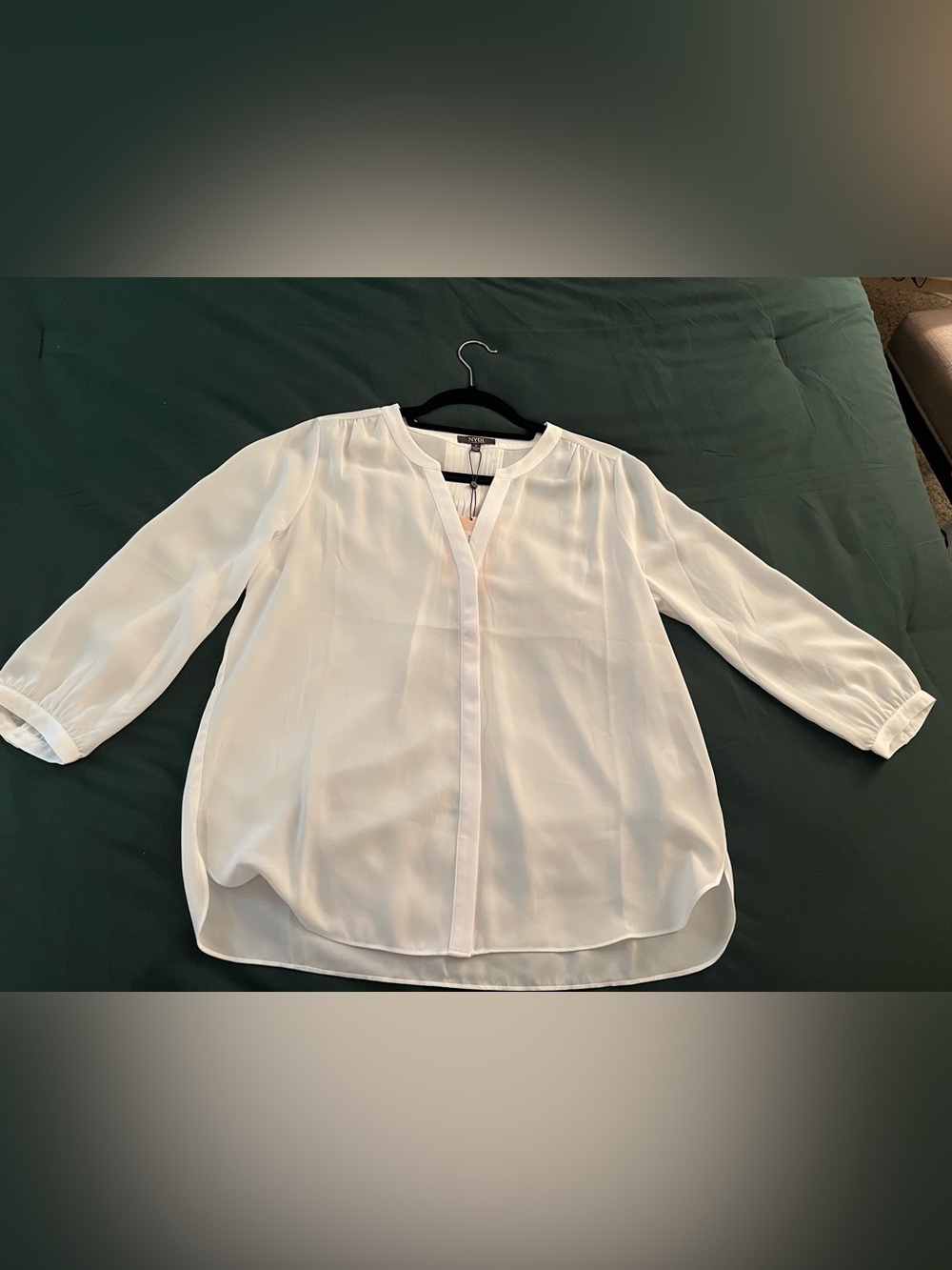 White NYDJ split neck popover blouse with 3/4 sleeves and pintuck detailing sz S